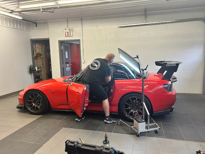 Paintless dent repair technician working a dent for a Guelph customer